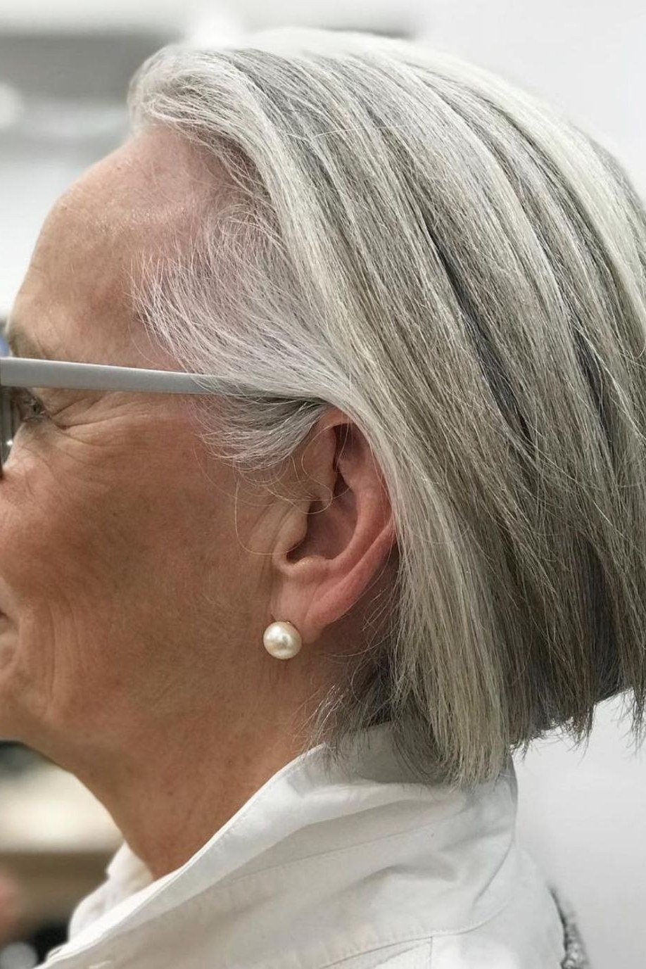 Classic grey pixie haircut for women over 70, front view