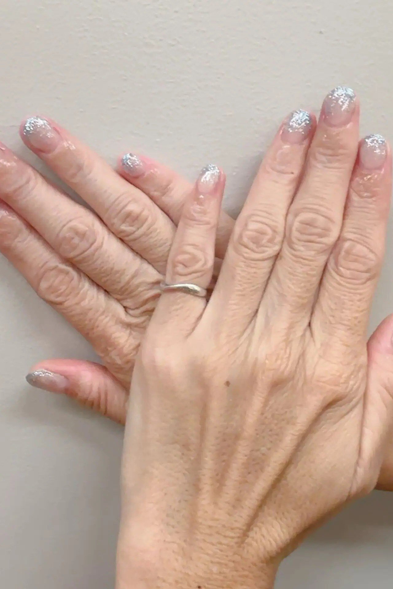 Icy Silver Shimmer Short Nails - icy shimmer short mature hands, glitter winter nail design for women over 60