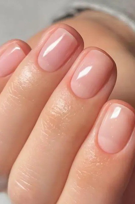 Glossy Blush Pink Oval - short nude nail idea for women over 50