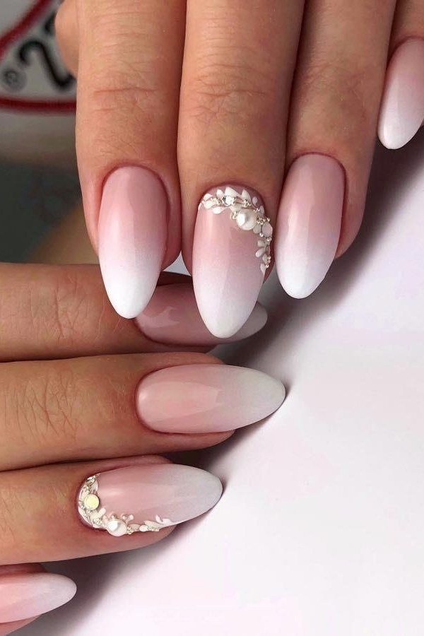 long almond baby boomer nails with pearl and rhinestone accents