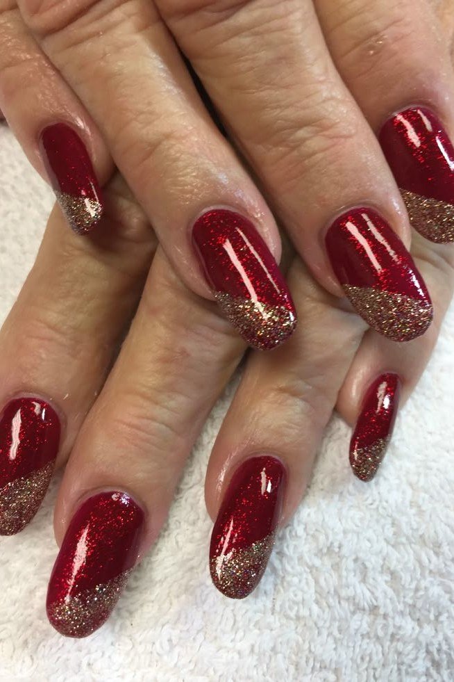 Red Nails with Gold Glitter French Tips for women over 60