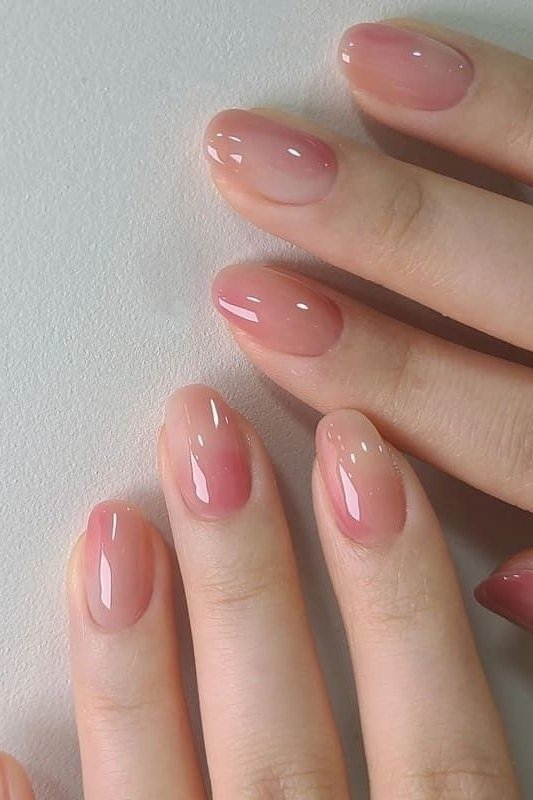 Short pink jelly nails with glitter accent nails
