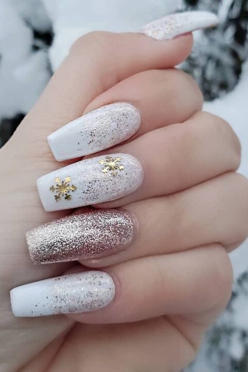 White Coffin Nails with Gold Snowflake Charms, fun winter nail idea for women over 60