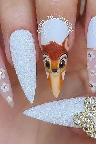 White and pink stiletto nails with Bambi portrait daisies and butterfly charm
