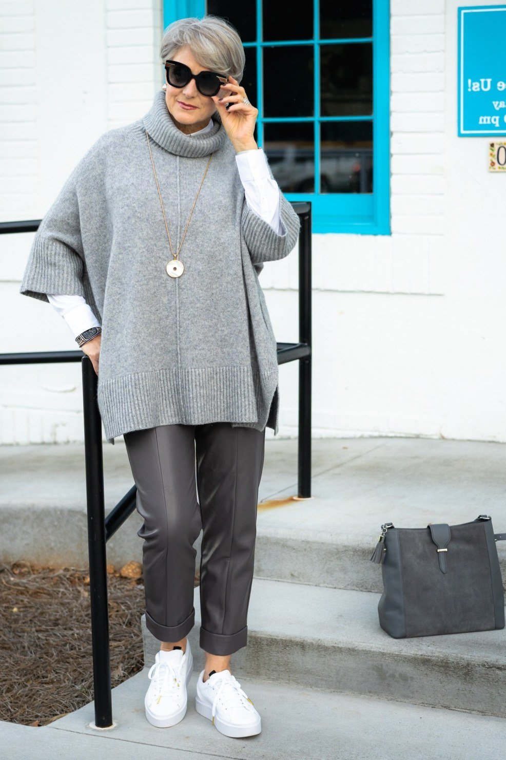 Grey poncho with grey trousers fall outfit idea for women over 60