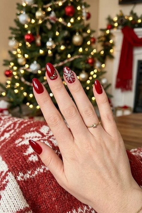 red glitter christmas nails photographed by christmas tree
