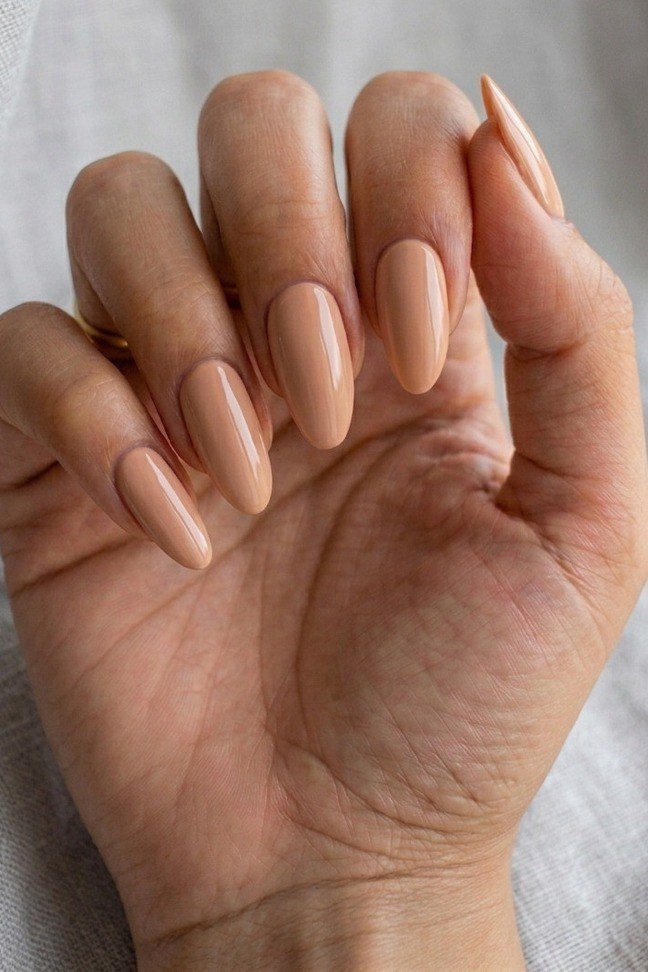Nude Beige Medium Almond Mature Palm - elegant nude nail design for women over 60