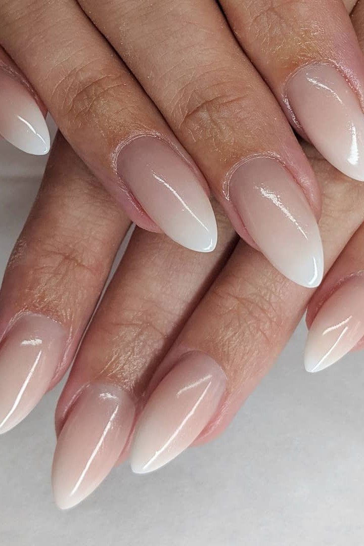 white nude baby boomer ombre on long almond nails