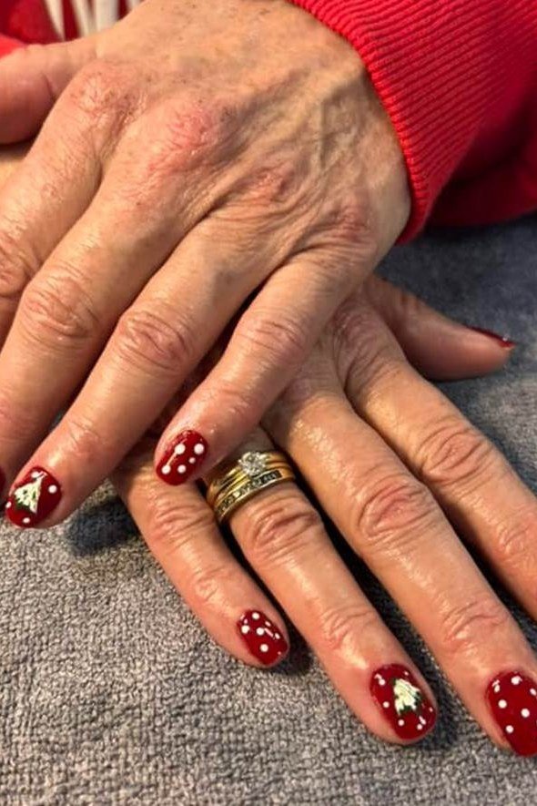 Red Glitter Nails with a Red Sweater for women over 60