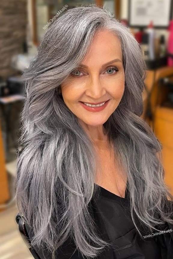 Long dark-silver voluminous waves for women over 50