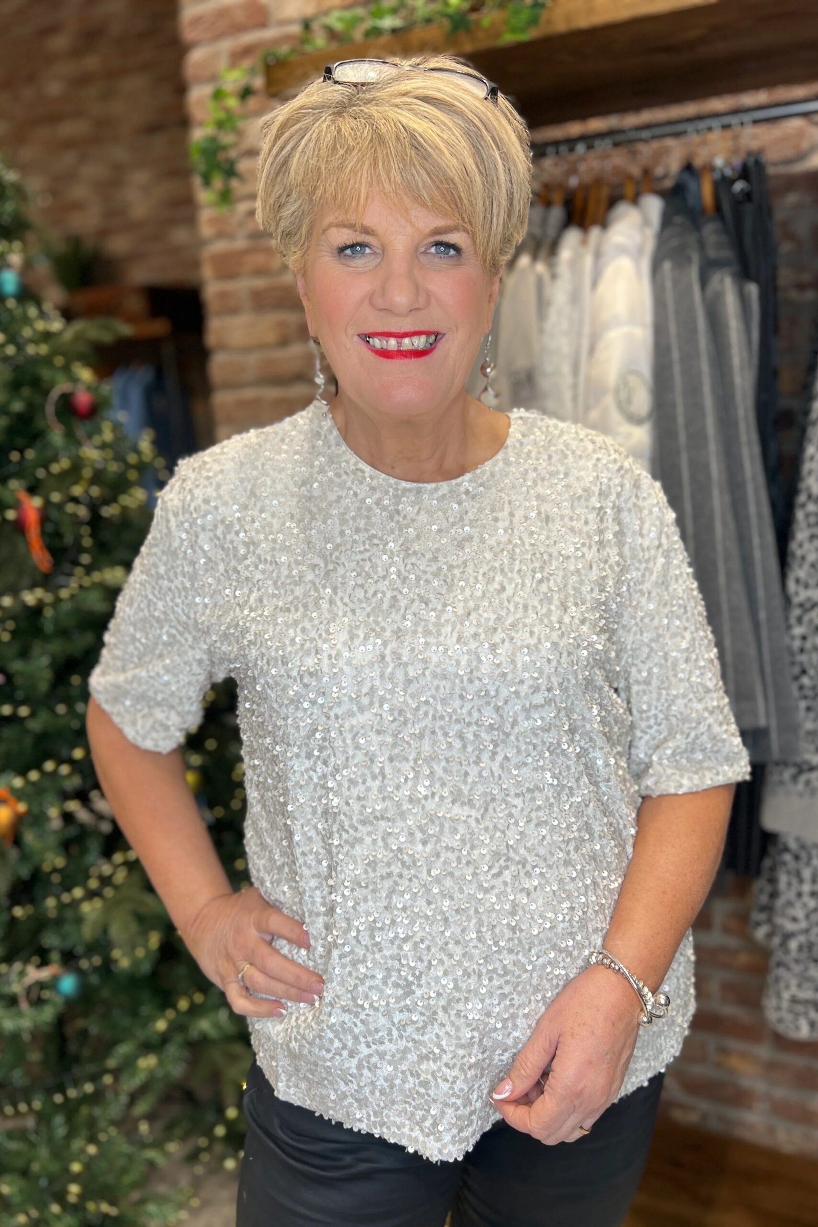 holiday evening outfit for women over 60: white sequin top for holiday night