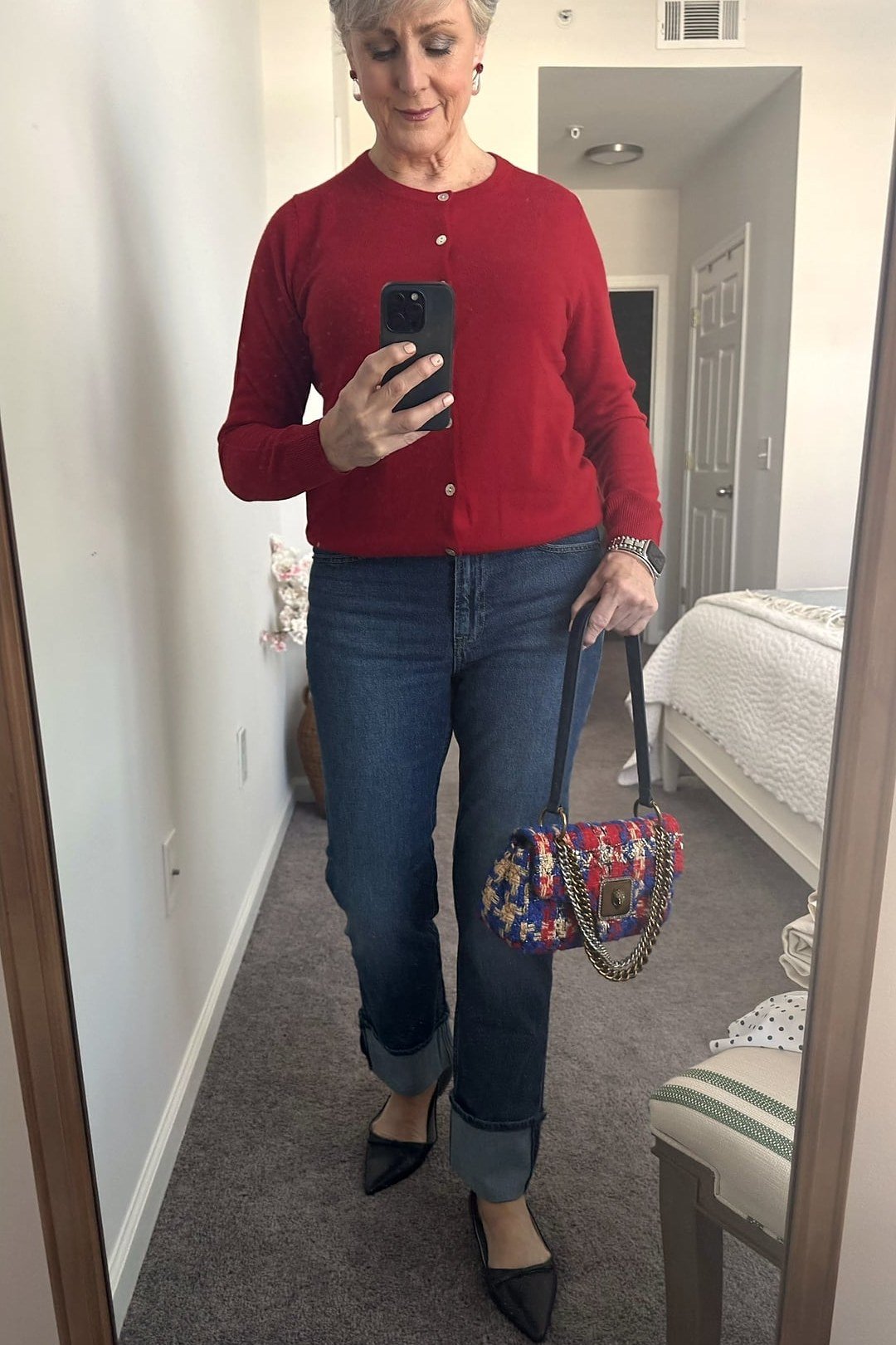 Red Cardigan with Dark Jeans and Sneakers on a woman over 50, fall outfit idea