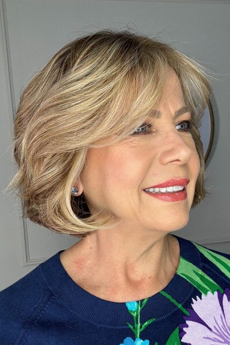 Feathered blonde bob haircut for women over 50