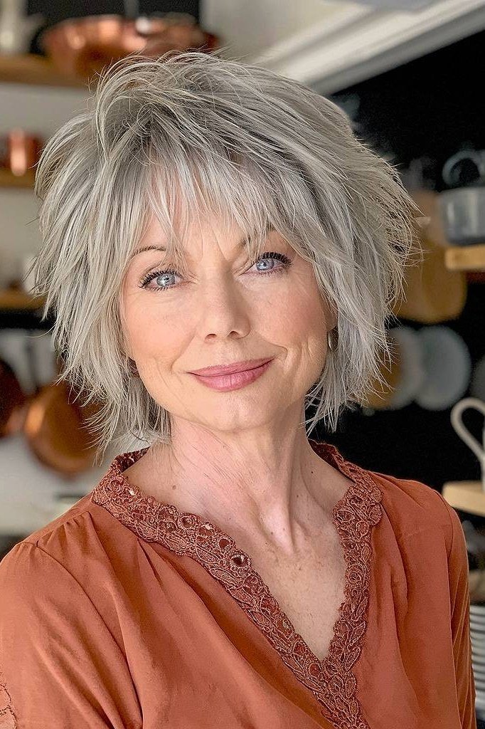 Silver shaggy bob with bangs for women over 60, front view