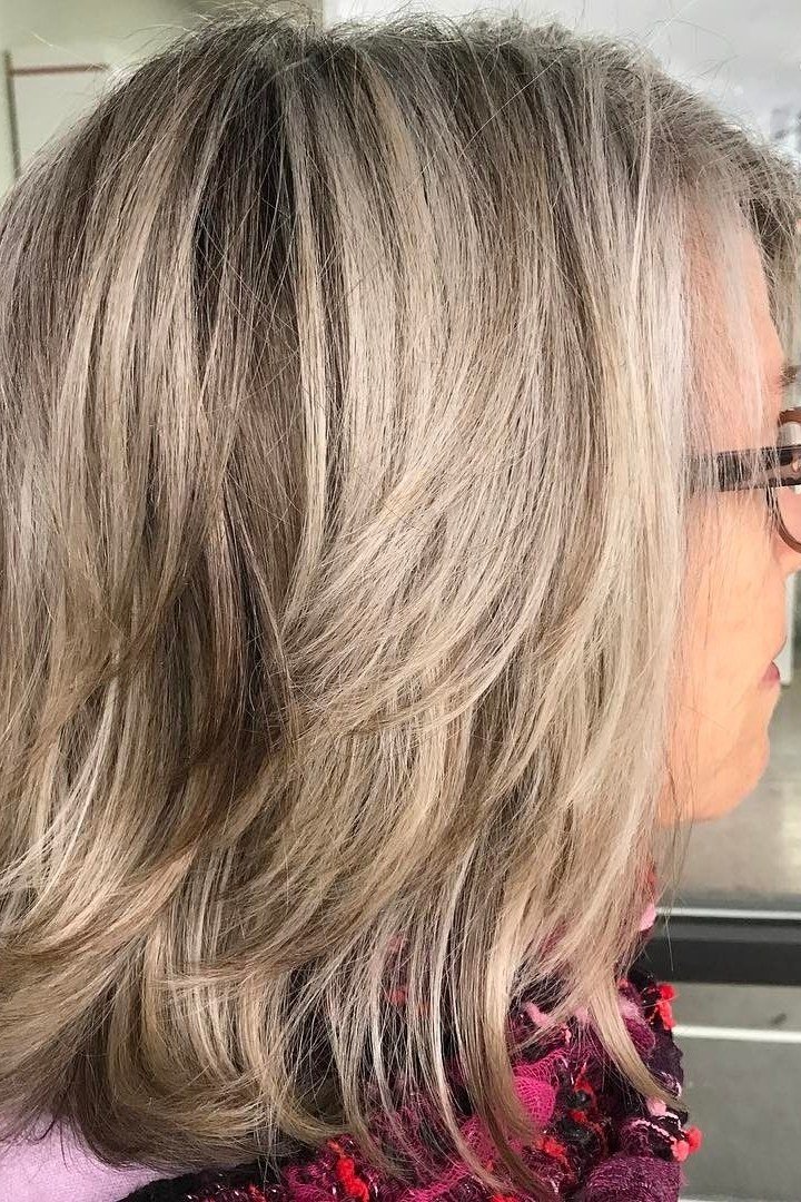 grey layered medium straight hairstyle, side view, glasses for women over 50