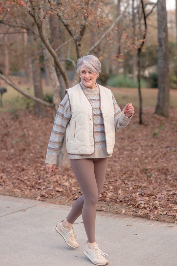Cream quilted vest with mauve leggings fall outfit idea for women over 60