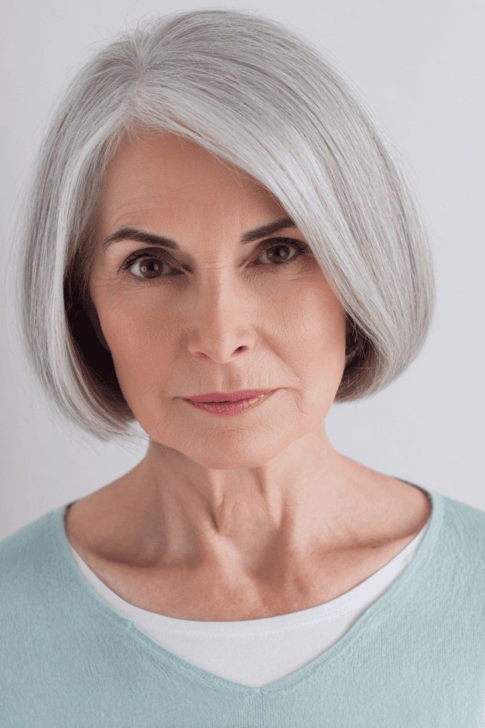 Sleek silver chin length bob for women over 60