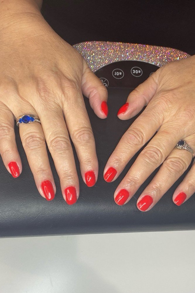 True red gel manicure for mature hands