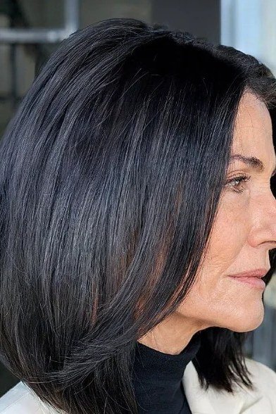 Sleek black lob with glossy straight finish for women over 40
