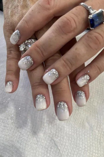 Ring Adorned Silver Glitter Nails - silver glitter short mature hands rings, glitter winter nail design for women over 60