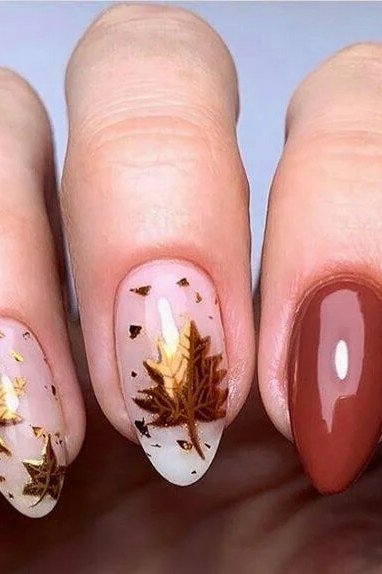 20. Burgundy Nails With Gold Maple Leaves - Thanksgiving nail art idea for women over 50
