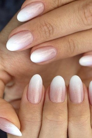 pink white baby boomer fade on long almond nails