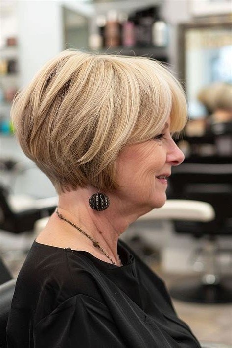 Blonde Layered Bob With Side-Swept Bangs for women over 60