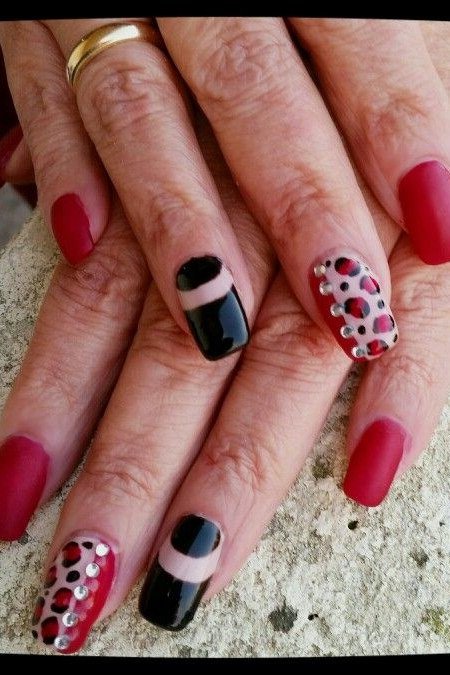 Red nails with black and white art for older women