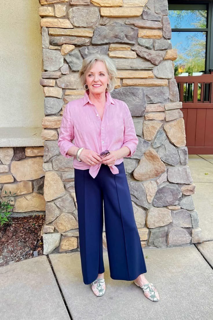 pink button down navy wide leg trousers over 50