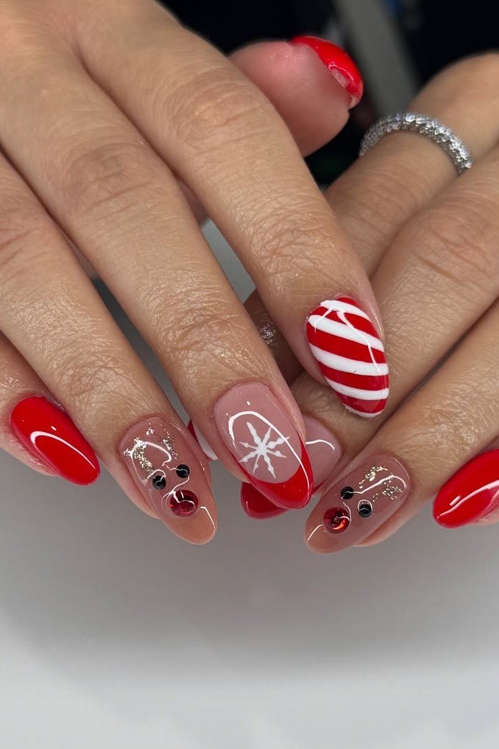 Red with candy cane and snowflake nail art mix - Christmas nail design for older women