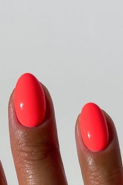 Vivid red coral oval nails