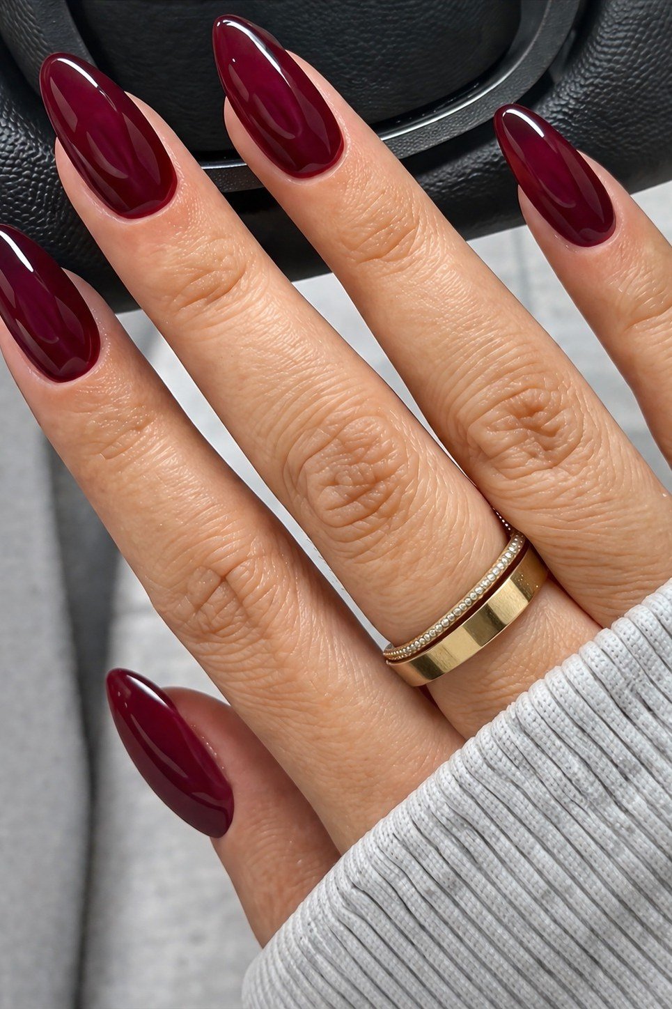 Bright burgundy glossy almond gel nails, juicy fall red manicure