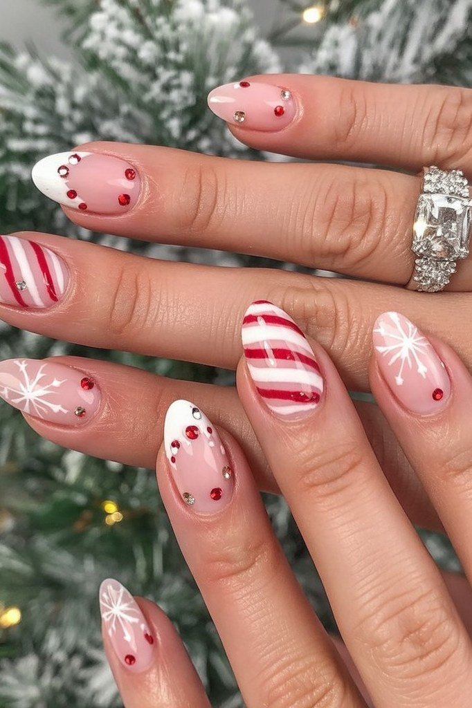 nude christmas nails with candy cane stripes and red dots