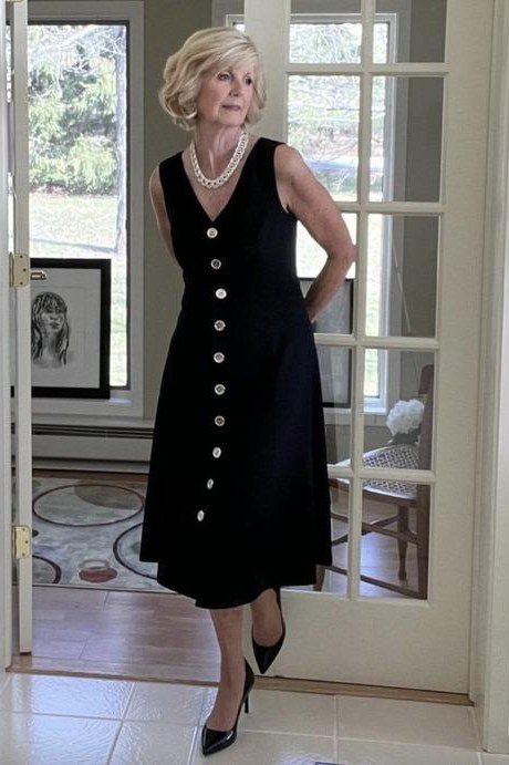 Black button-front sleeveless midi dress for women over 50