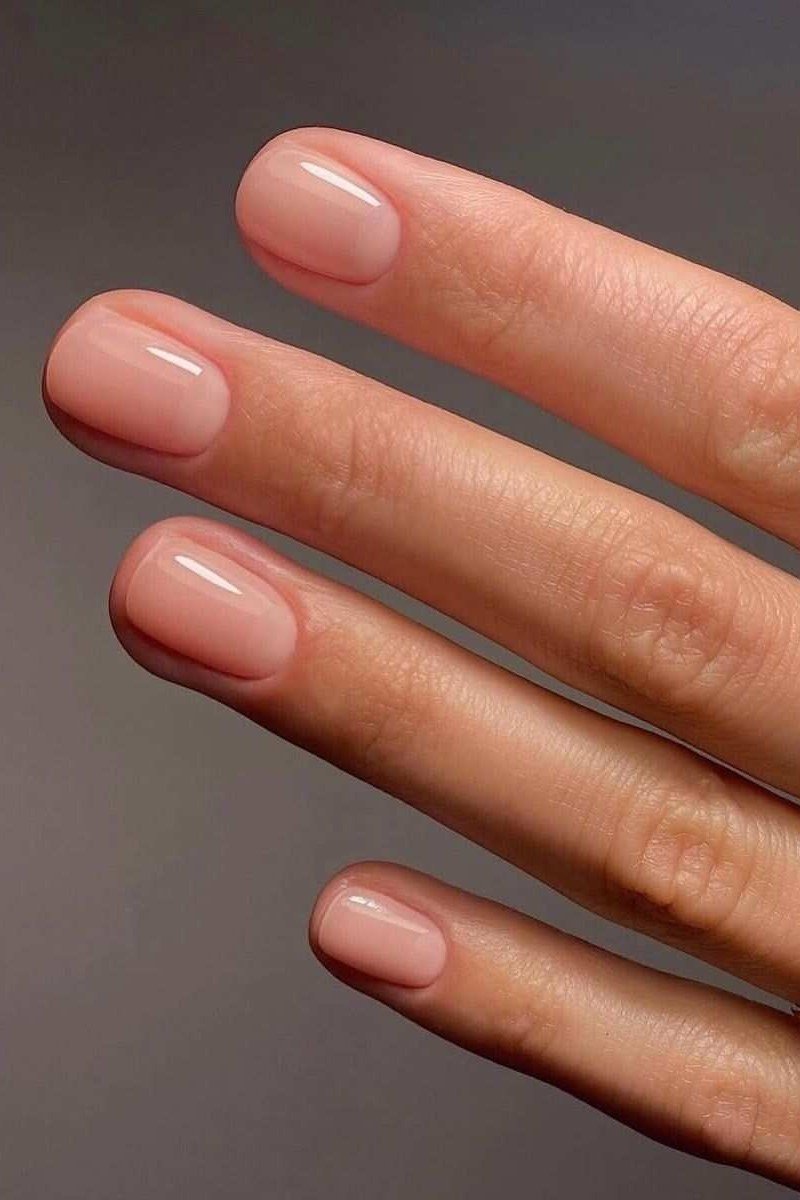 Warm Blush Pink with Gold Rings - short nude nail idea for women over 50