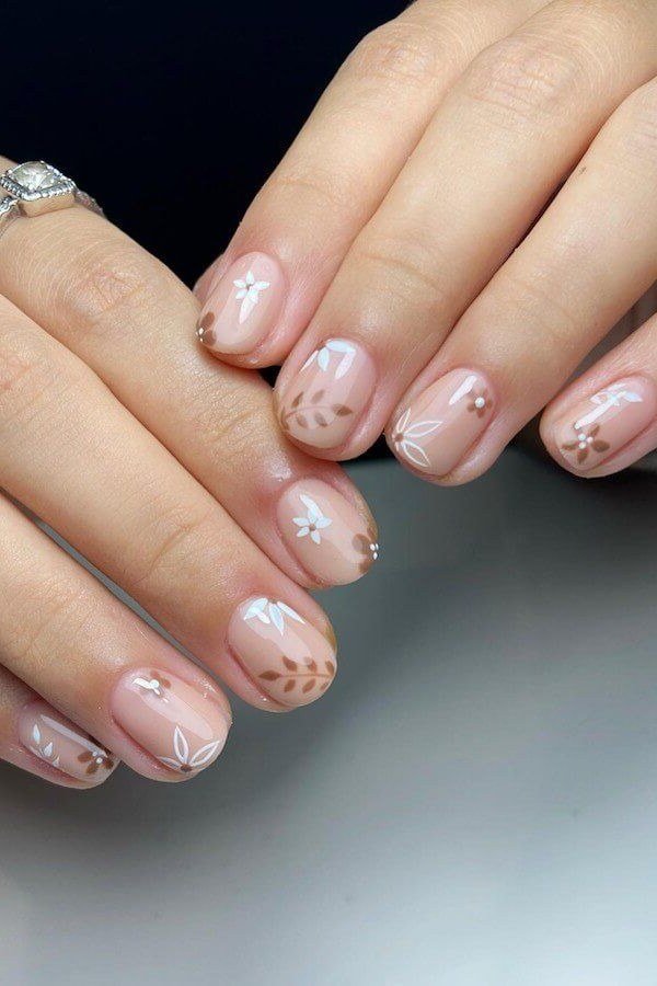 Tiny Daisy Nude Nails - nude nail art idea for women over 40