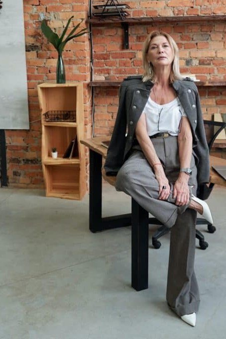 Work outfit for women over 40: gray blazer with gray wide-leg trousers