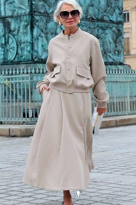 beige bomber jacket with cream maxi skirt, modern casual outfit for women over 50