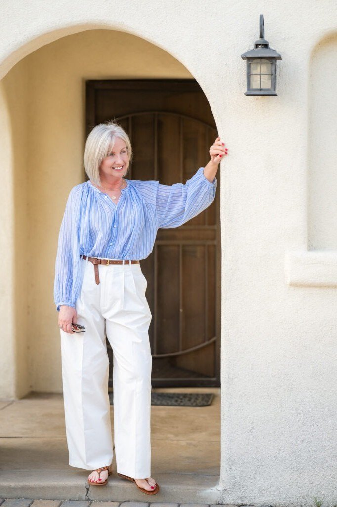 light blue shirt white wide leg trousers over 50