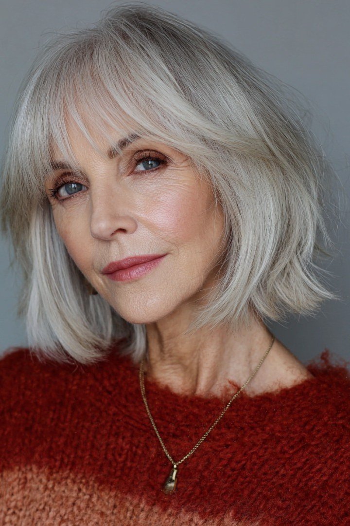 Silver lob with wispy bangs for women over 60