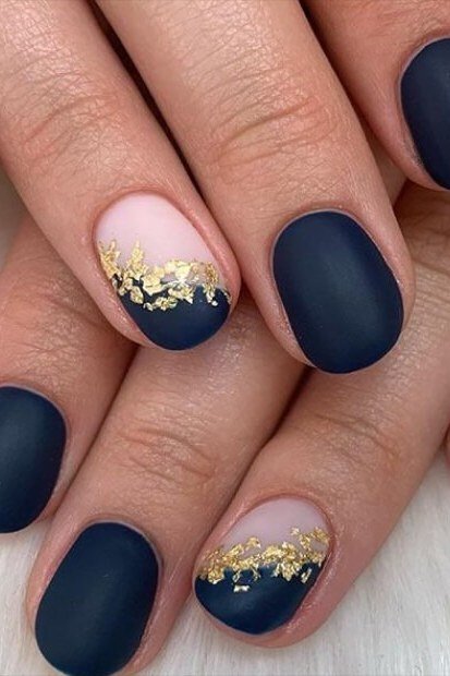Navy matte with gold glitter ombre tips short, elegant fall nail design for women over 40