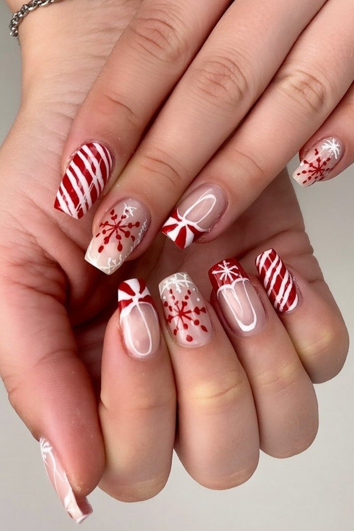 nude nails with candy cane and snowflake christmas art