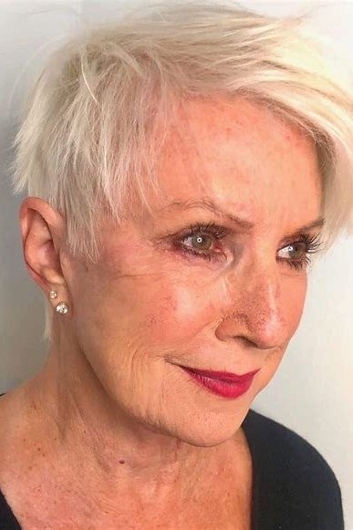 White softly layered pixie, front closeup with red lipstick, timeless hairstyle for women over 70