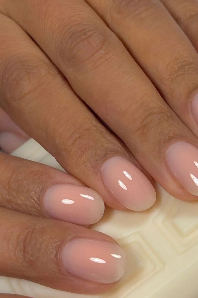 Nude Pink on Deep Skin - short nude nail idea for women over 50