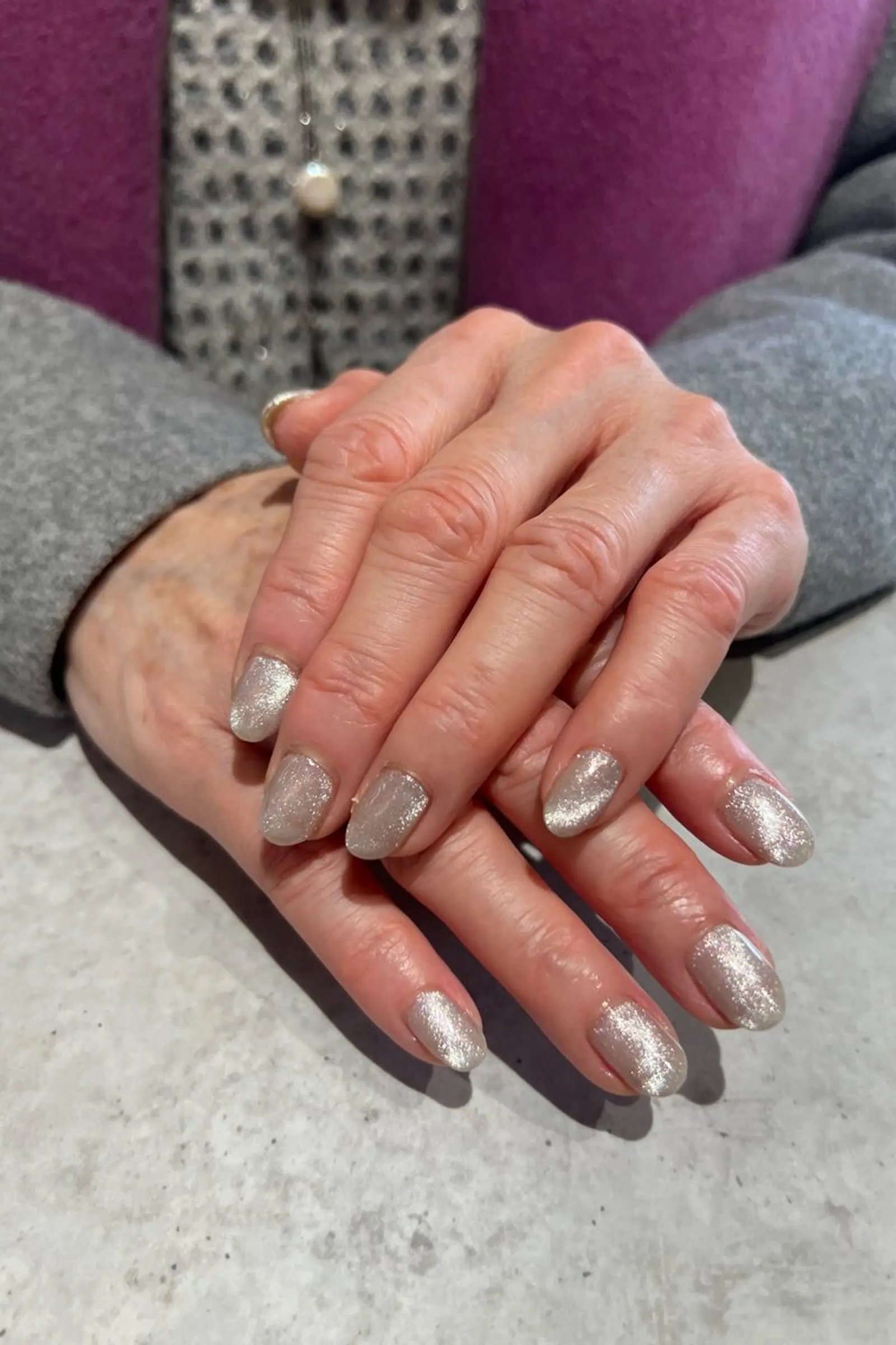 Silver White Cat Eye Nails - Bright silver white shimmer covers these short, oval nails with a magnetic glow.