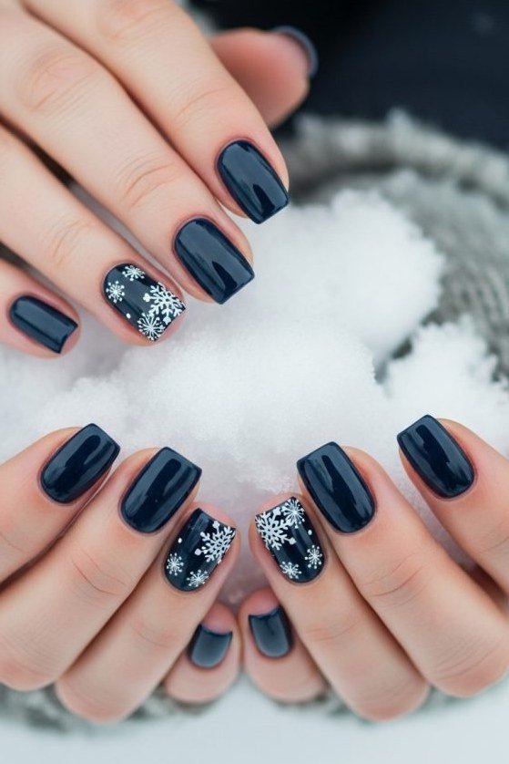 midnight navy with snowflake accents, holding snow