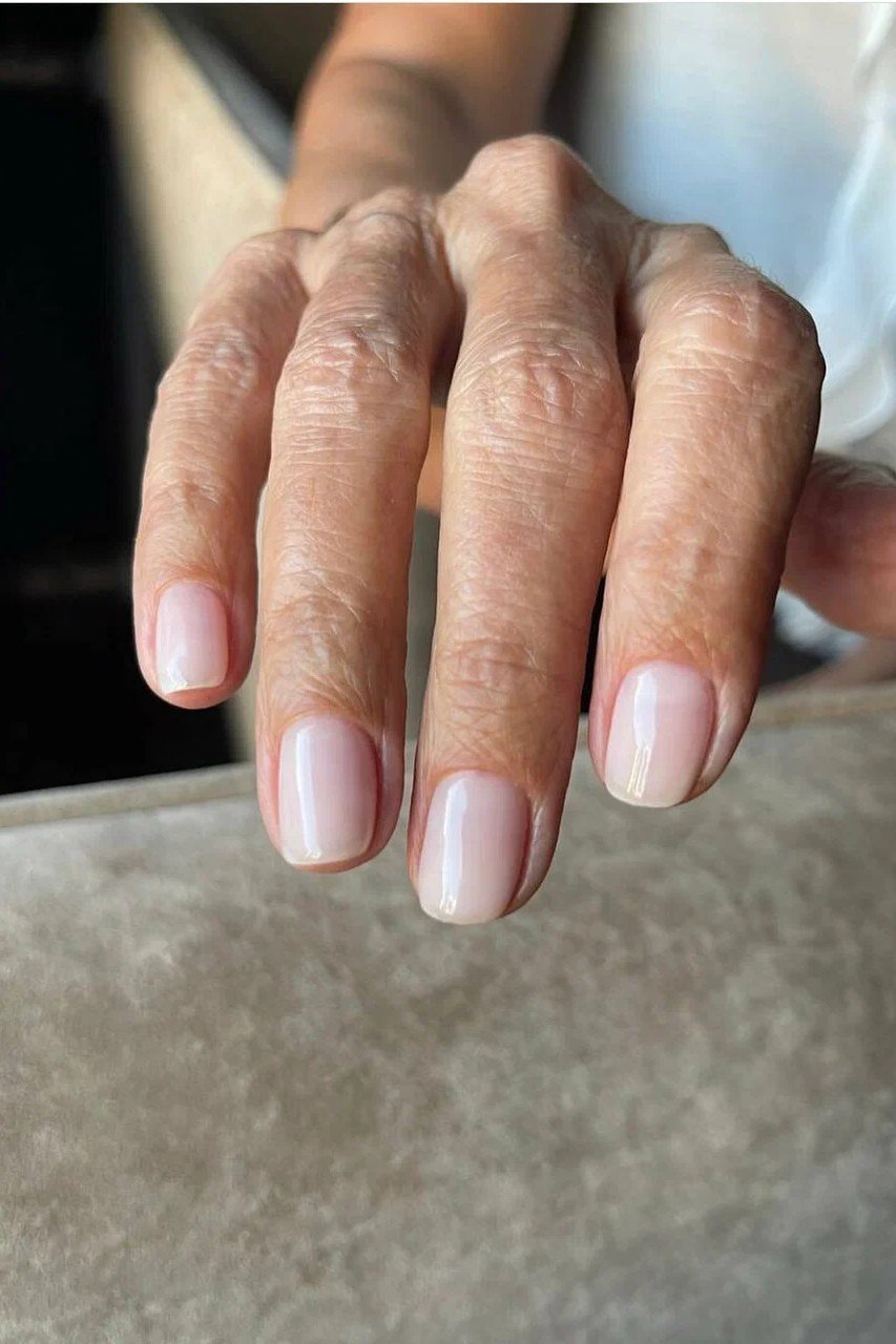 Milky pink white gel nails for older women