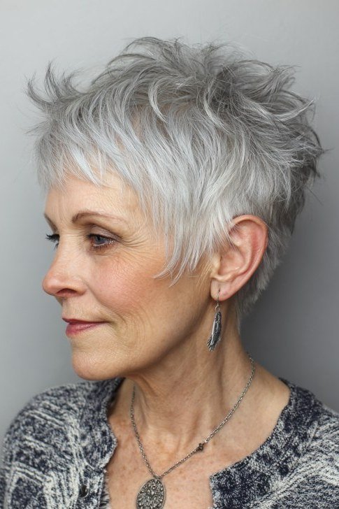 Silver textured pixie shag haircut profile over 60