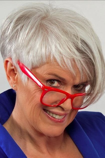 White pixie haircut with red glasses for women over 50