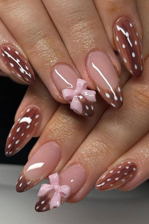 Almond nails in pink and burgundy with white spots and pink bows